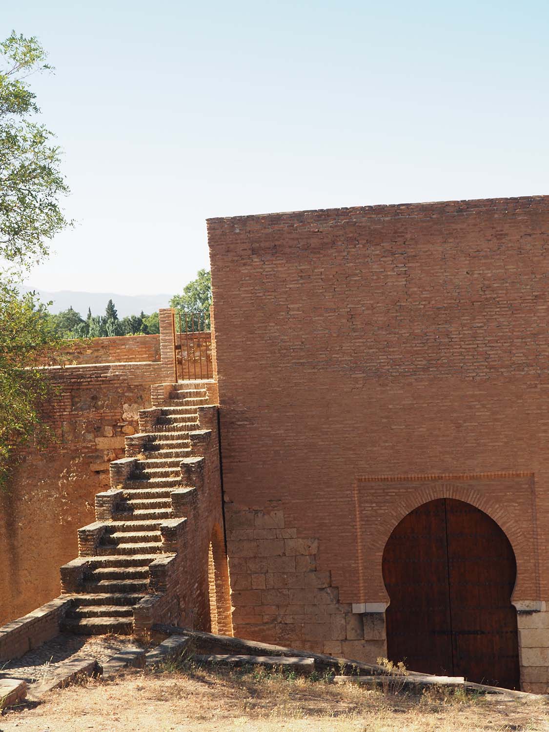Alhambra Alta - Stairs to the southern Alhambra wall on the left; the Puerta de Siete Suelos on the right
