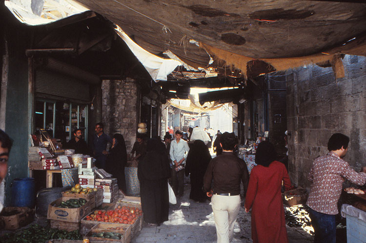 <p>View of vegetable market with awnings over street in Bab Qinnasrin Quarter, Aleppo</p>