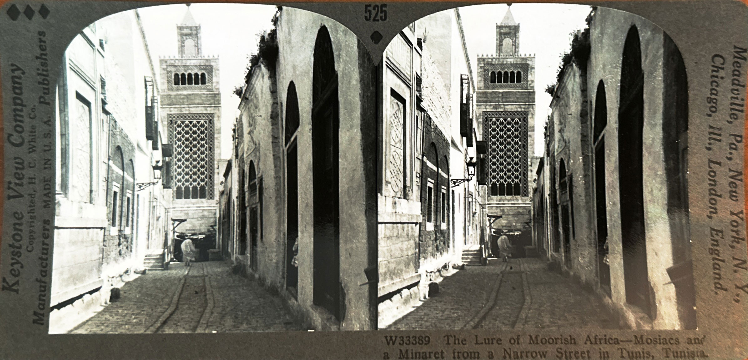 <p>"The Lure of Moorish Africa. Mosaics and a minaret from a narrow street in Tunis, Tunisia" (sic)</p>