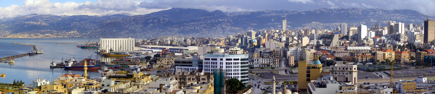 Panoramic view from north to south taken from the St. Louis clock tower, with the Souks Project seen on the left and the tall buildings of the Ashrafieh neighborhood on the right. The Kesrouan and Metn mountains are seen in the background, dotted with villages