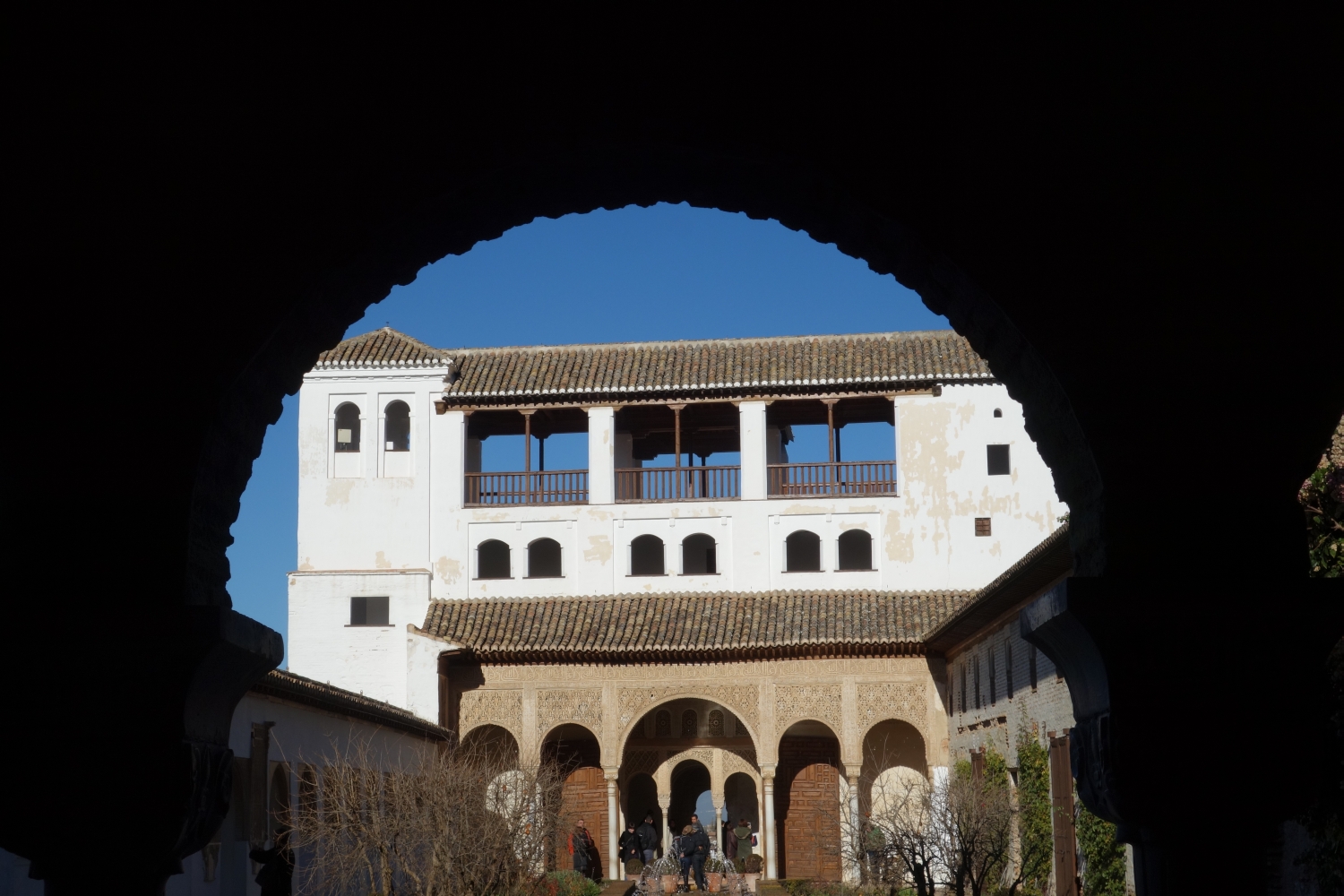 Acequía Court, view through archway to north pavilion
