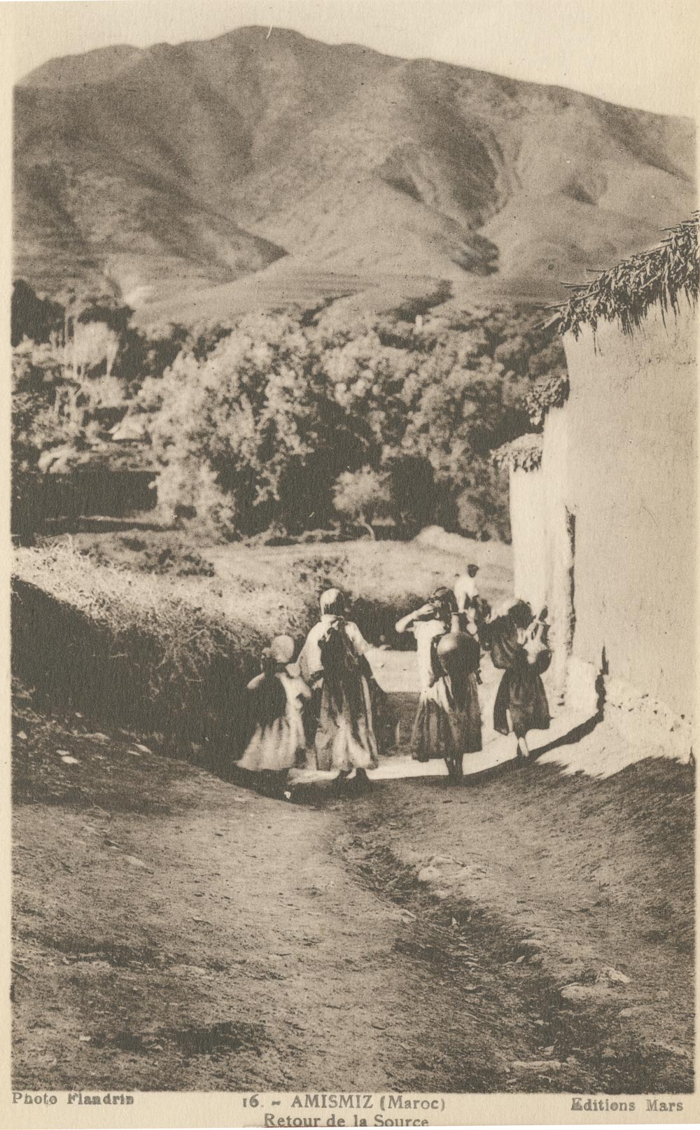 Women returning form the spring carrying water