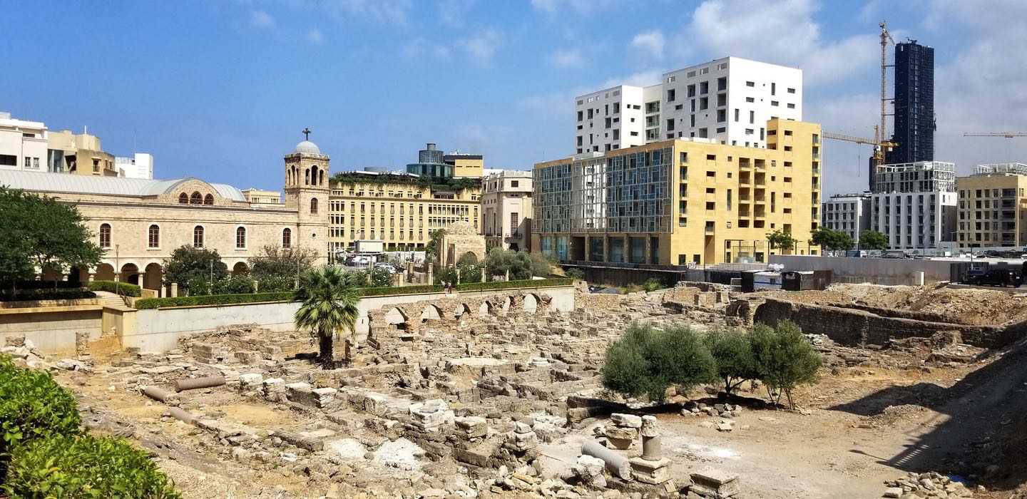 View over Roman archaeological site with St. George Greek Orthodox Cathedral in background.