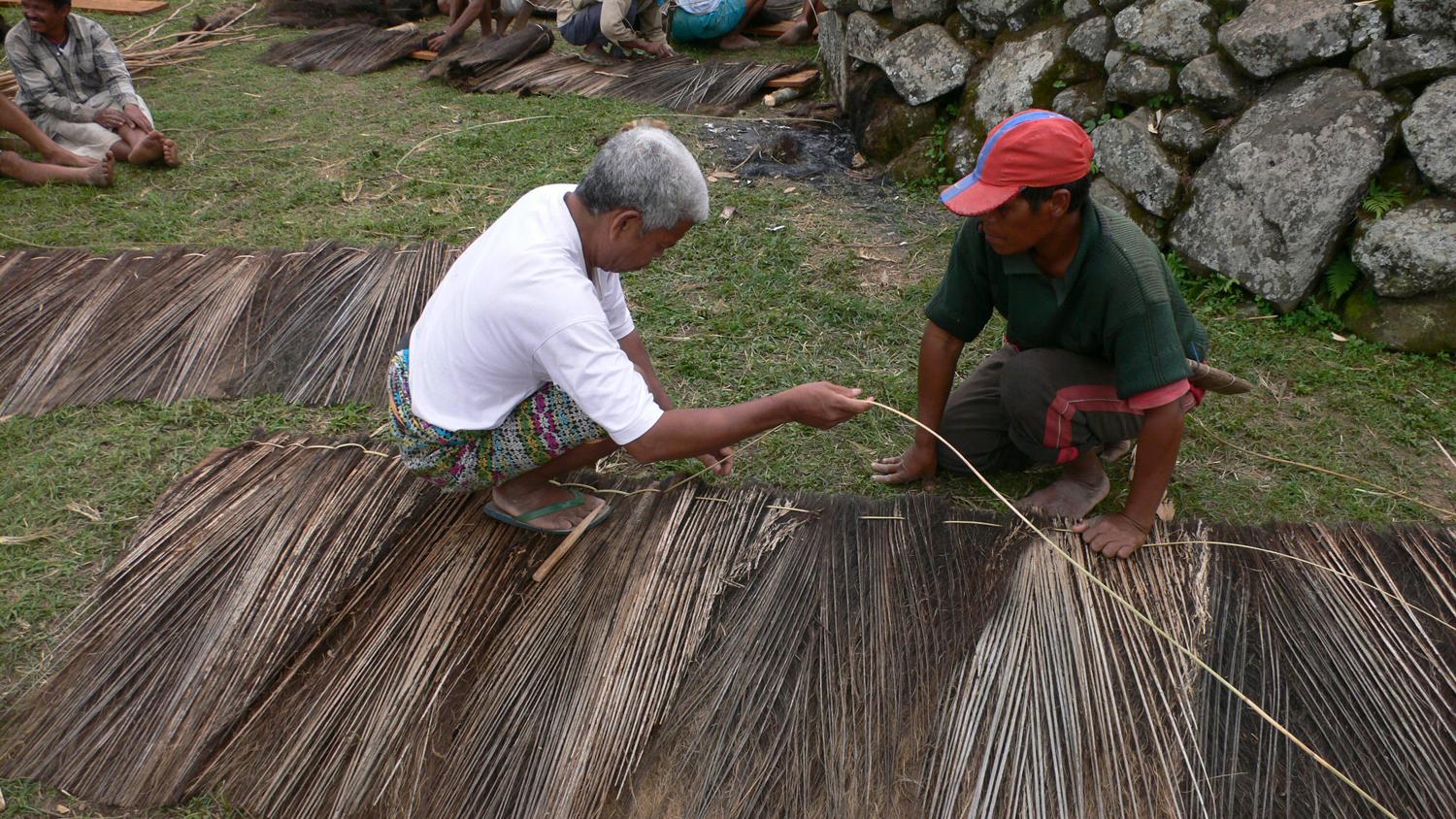 Villagers preparing the roof cover