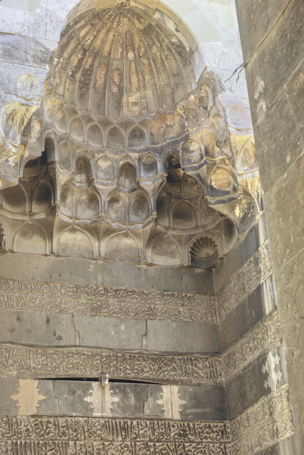 View of muqarnas hood over entrance portal.