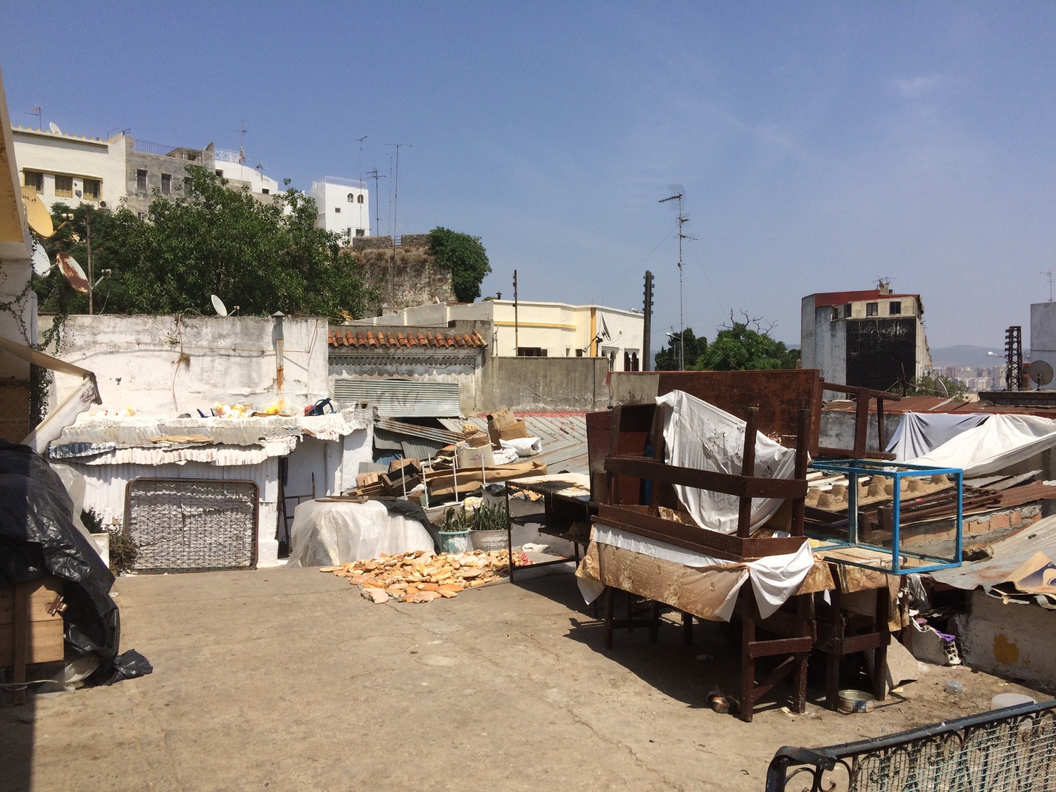 View toward the medina walls past gathered furnishing