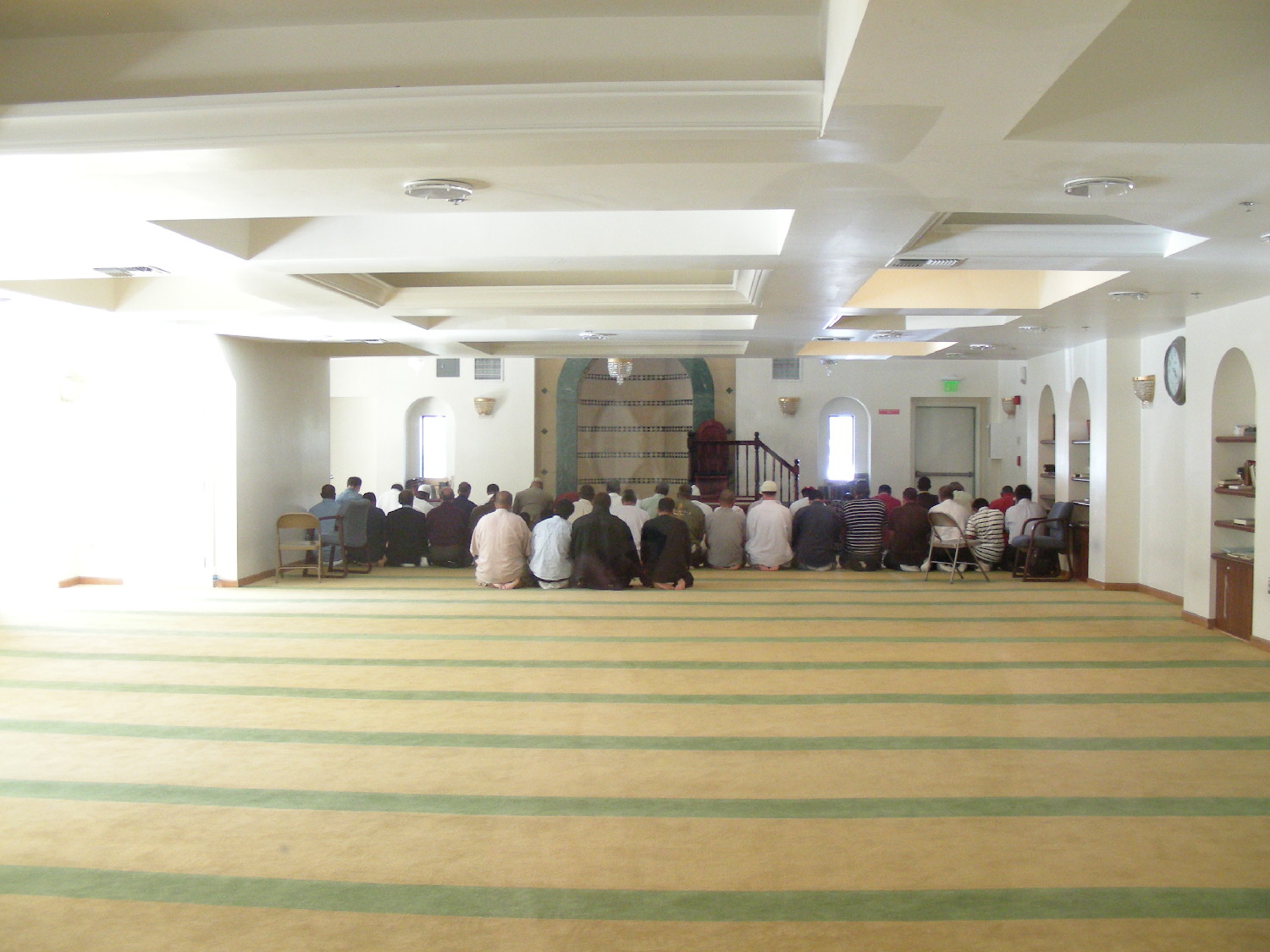 Prayer hall, with men praying