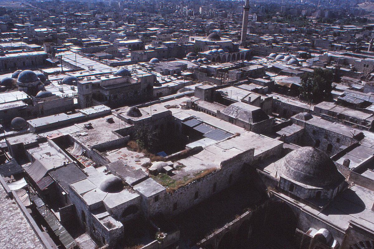 Madrasa al-Halawiyya - View over the southern end of Madrasa al-Halawiyya and the souqs to the south from minaret of Jami' al-Umawai. The souq was largely destroyed in the Syrian civil war. 
