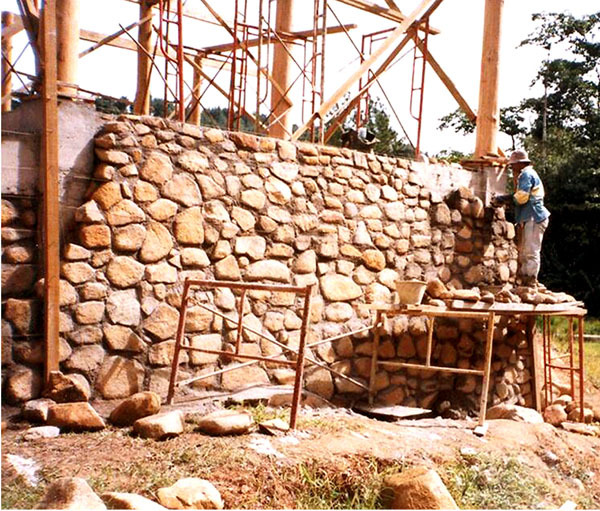 Recycled stone used as wall during construction