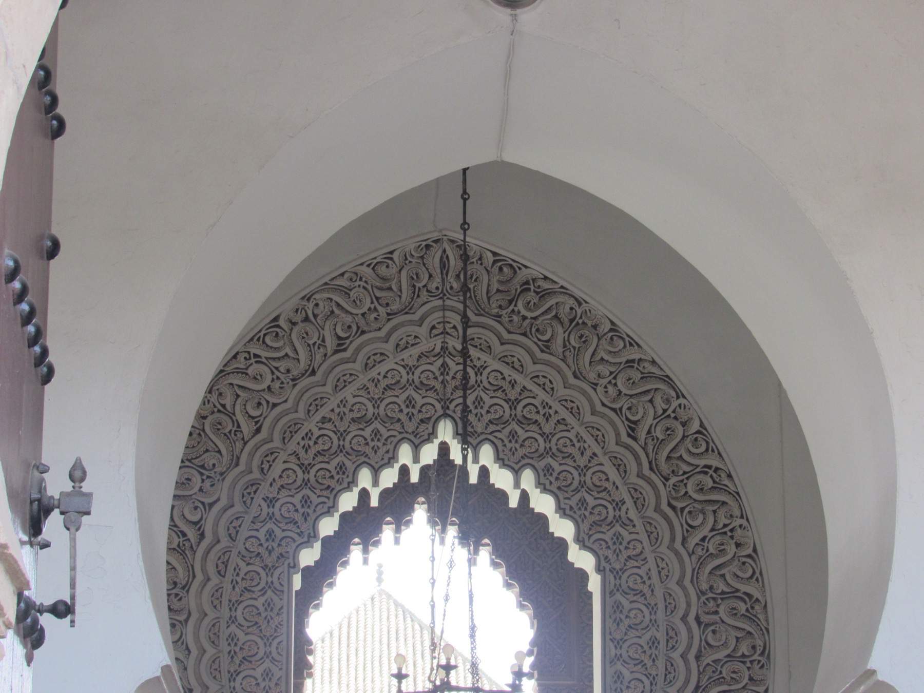 Interior view of Masjid Mohamedi with archway stone carving.