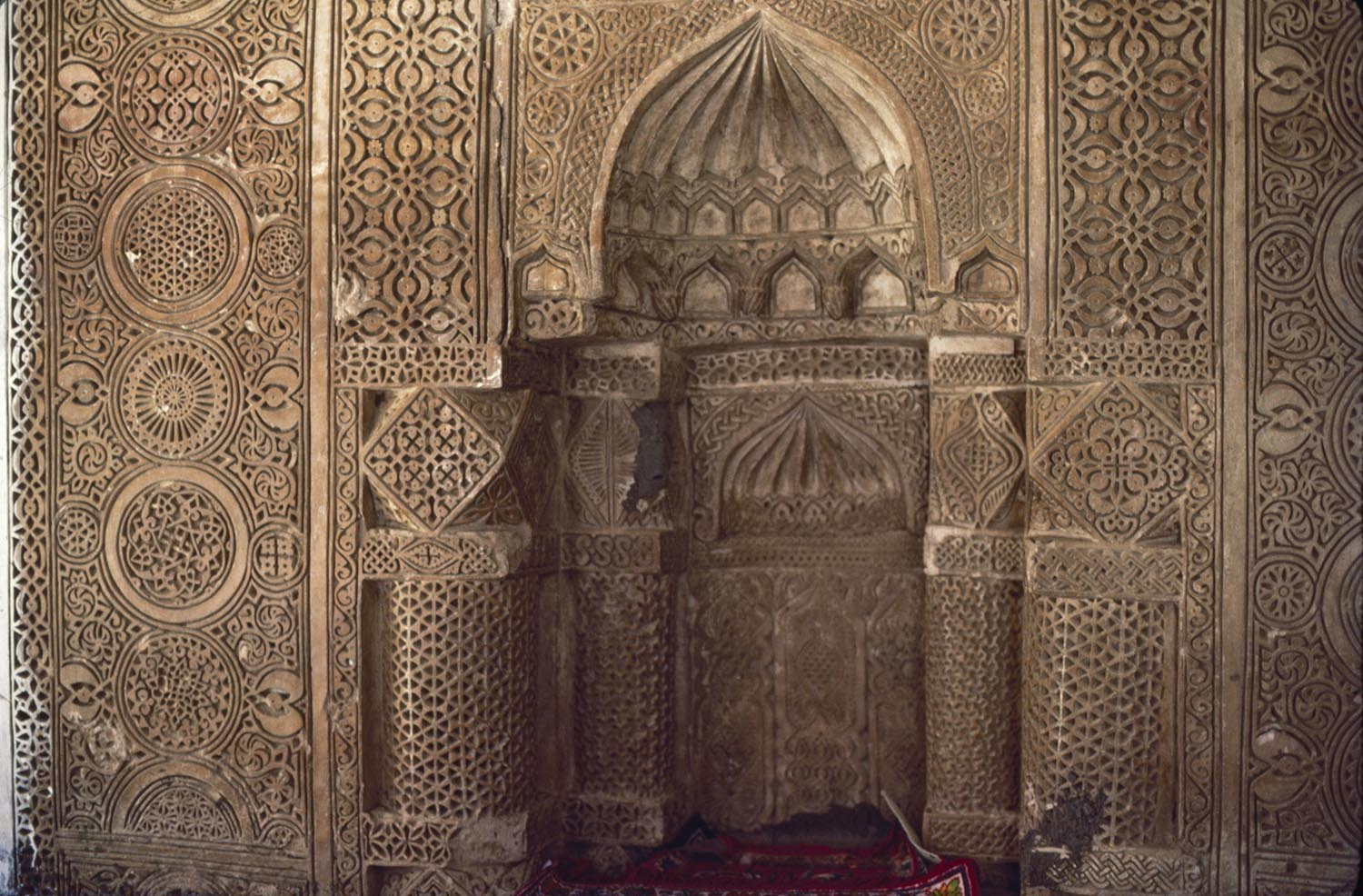 Carved stucco mihrab.