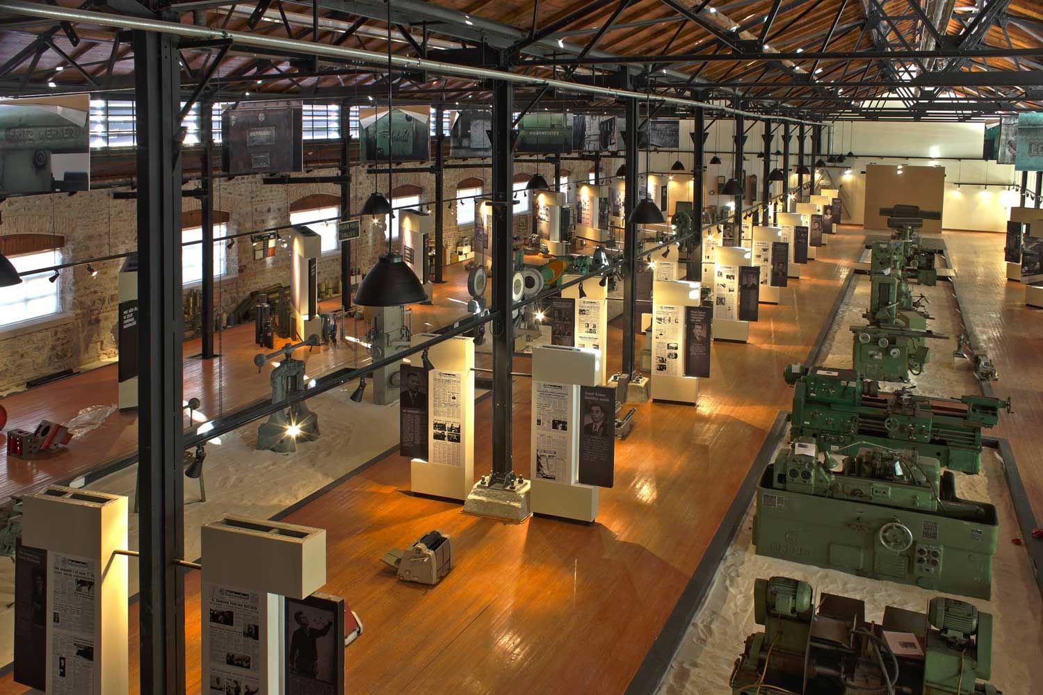 Aerial view of an installation inside an exhibition space at the Turkish Mechanical and Chemical Cooperation Industry and Technology Museum. 
