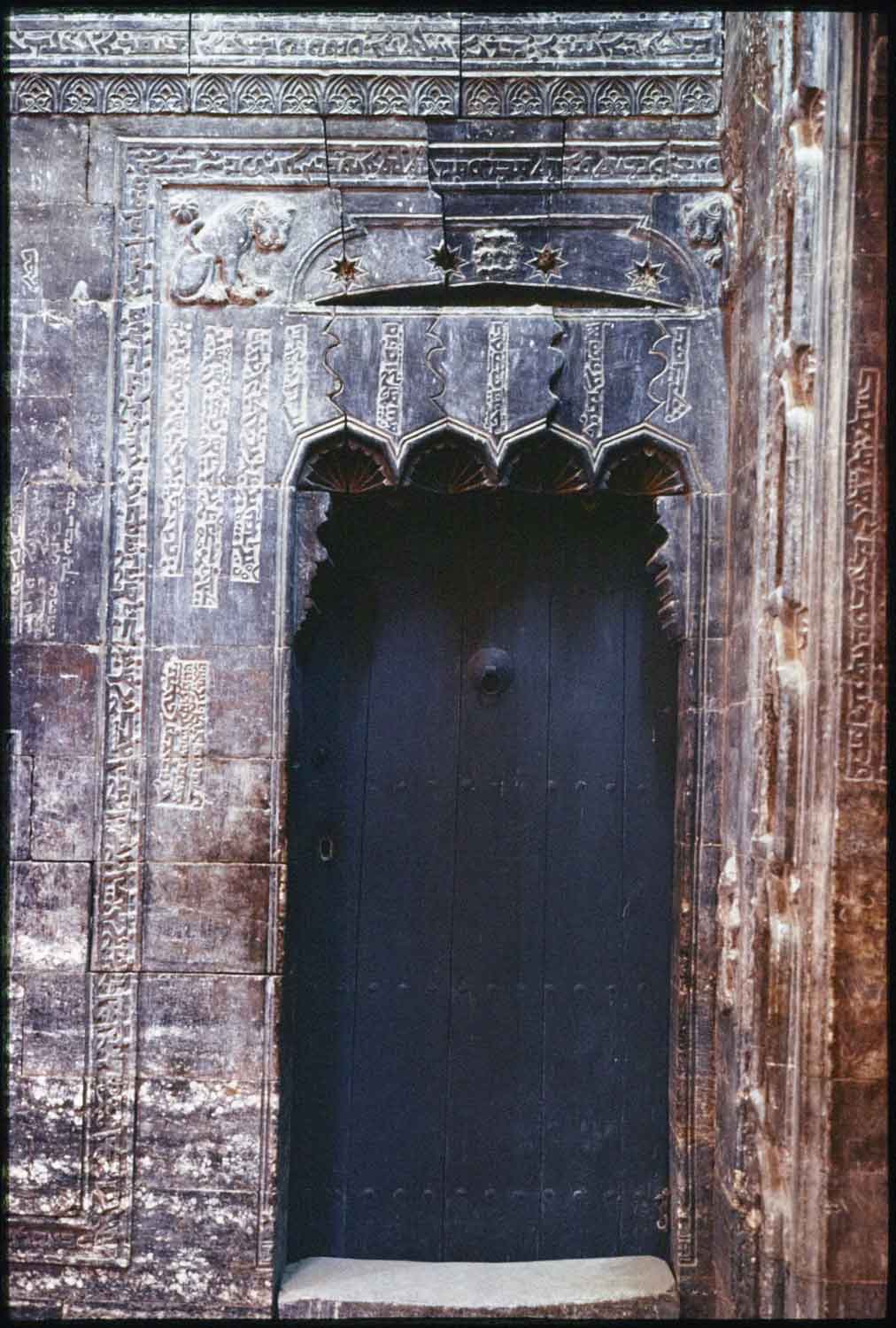 Northern exterior gate with inscriptions and lion