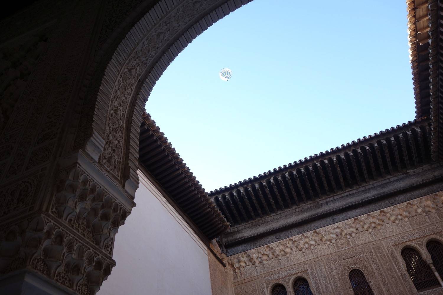 View through archway within Mexuar to eaves and sky above