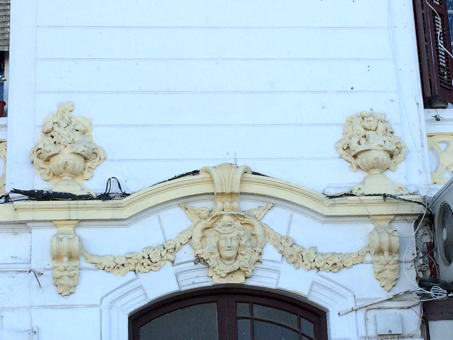 Detail view of decoration above a window on the facade