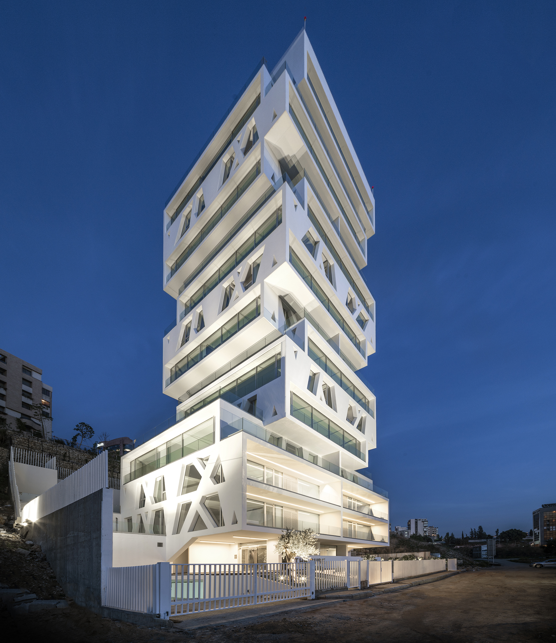 <p>Street facade by night.  The 56-metre-tall apartment building is in Beirut’s eastern suburb of Sin el Fil; there are 21 apartments, each floor containing one or two units that range in size from 117 to 234 m2.</p>
