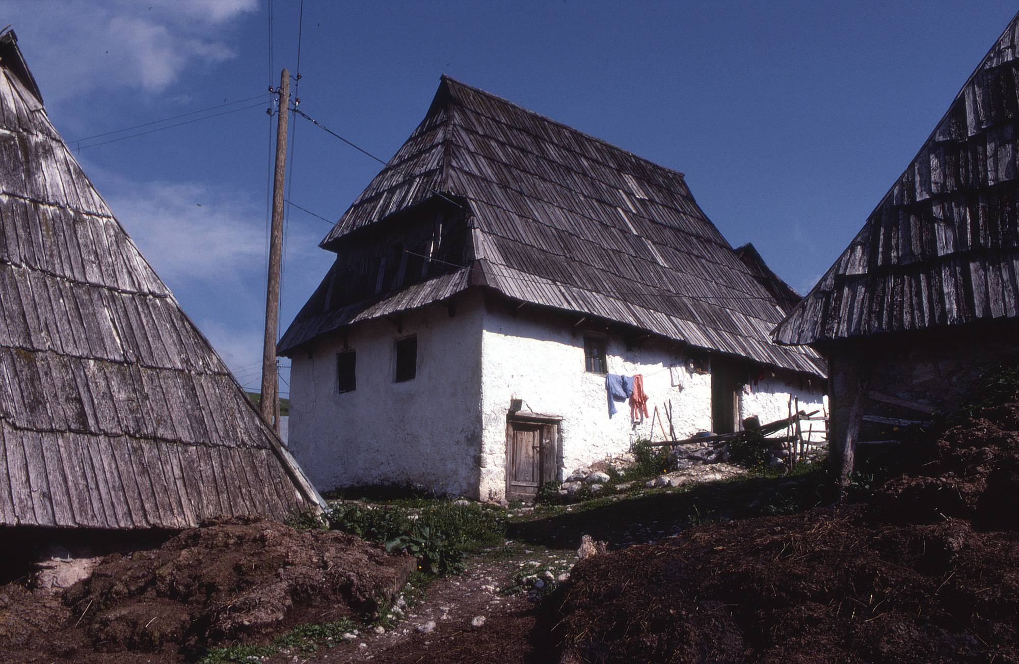 <p>In the highland villages around Sarajevo a local type of Dinaric house has an attic room set within the steeply pitched roof volume, with a dormer window providing light and views. According to M. Kadić (1967), a specialist on the rural vernacular architecture of Bosnia and Herzegovina, these attic spaces were called čardaci (chardaks), and they typically provided sleeping quarters for young couples in an extended household.</p>