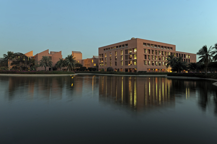 Aga Khan University - The campus as seen from the man-made pond at dusk