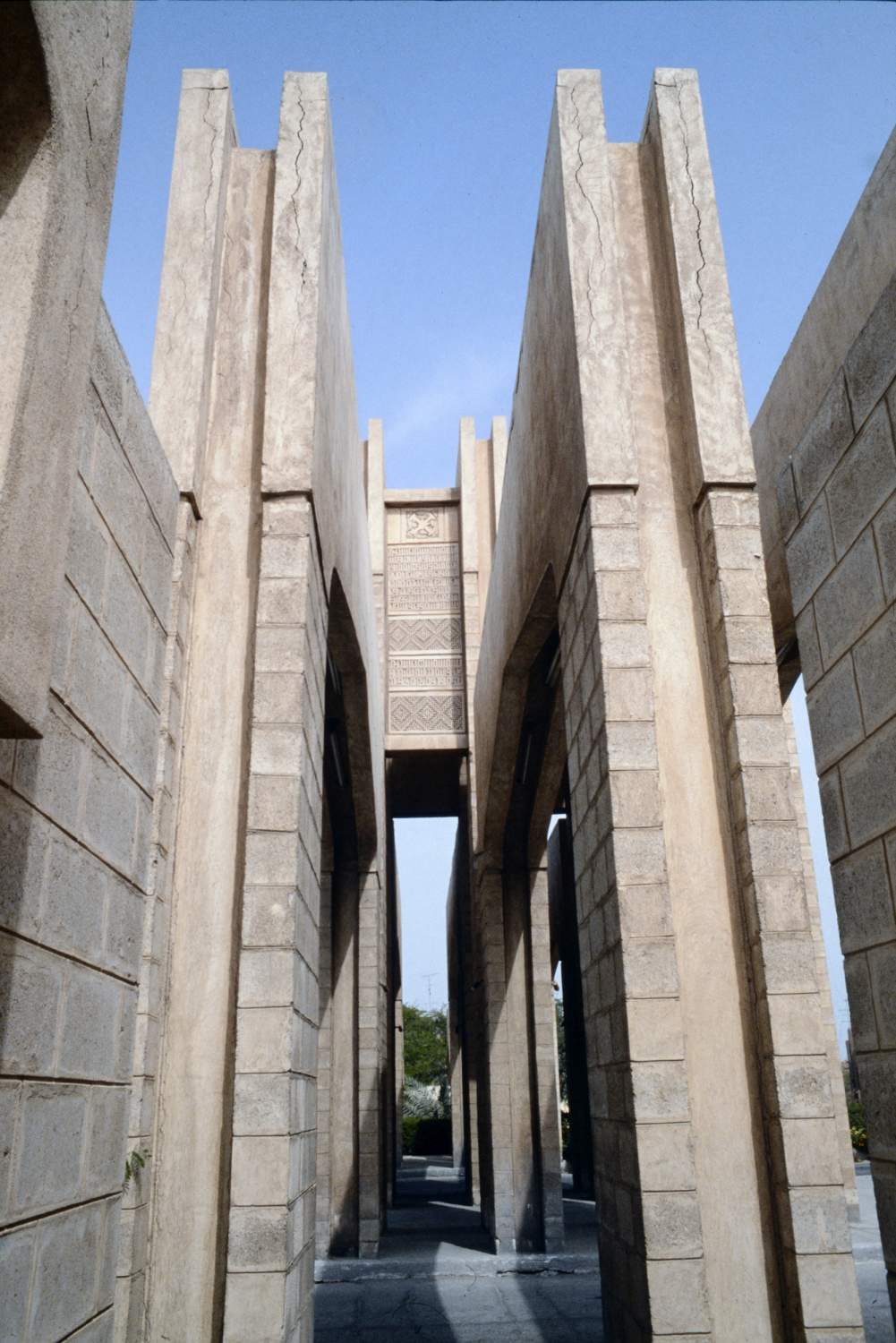 <p>View through side of gate, showing detail of concrete arches.</p>