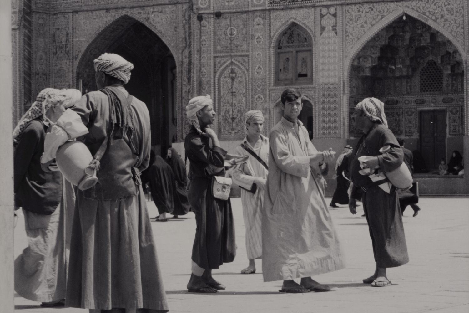 <p>Water sellers in the courtyard of Mashhad al-Kazimiyya, Baghdad.</p>