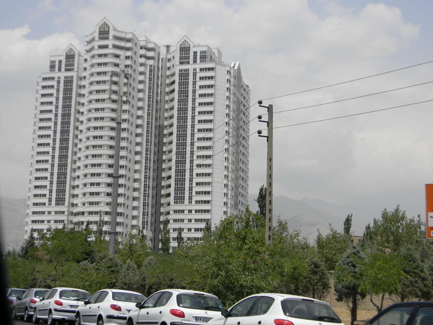 View of a tall residential building in the Elahiye District of Tehran, Iran.