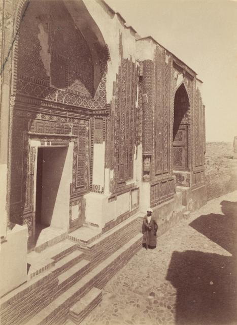 Exterior view looking north within the corridor beyond the middle chahar taq. In the foreground is the entrance portal (pishtaq) of the Amir Zadeh mausoleum, followed by the Shad-i Mulk Agha mausoleum