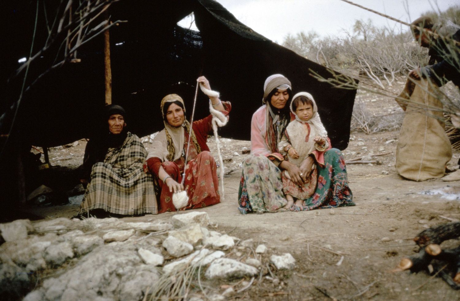 Qashqa'i woman spinning in a camp in Buzpar, Iran.