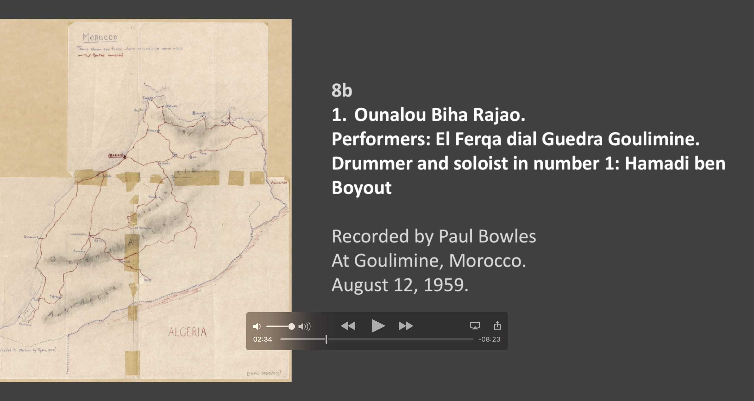 Hamadi Ben Boyout - 8B Track 1 Ounalou Biha Rajao.
Performers: El Ferqa dial Guedra Goulimine 
Drumming and solo singing are by Hamadi Ben Boyout.

Recorded by Paul Bowles at Goulimine, Moroccan Sahara.
August 12, 1959
