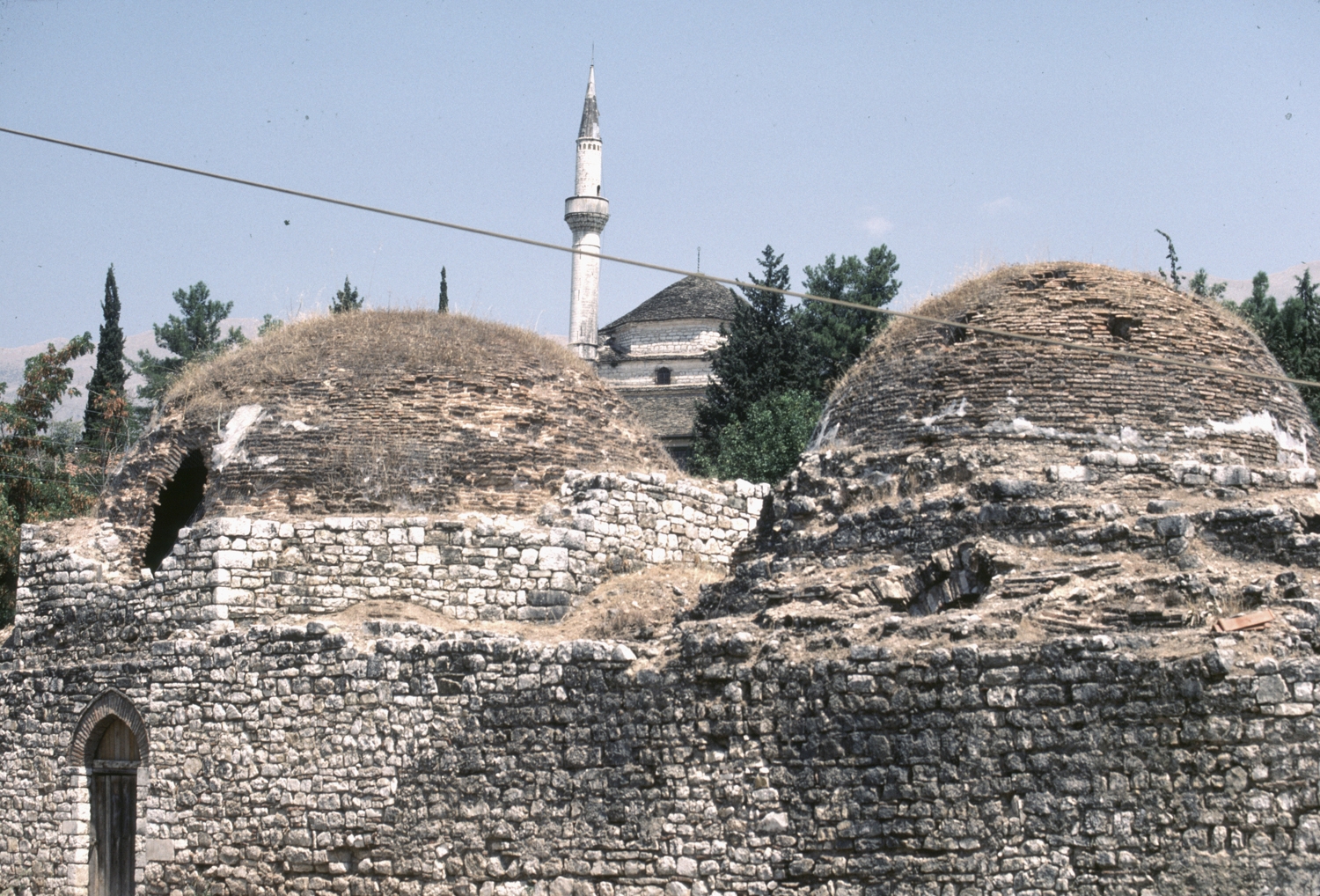 View of two domes, with the Aslan Pasha Mosque in the background