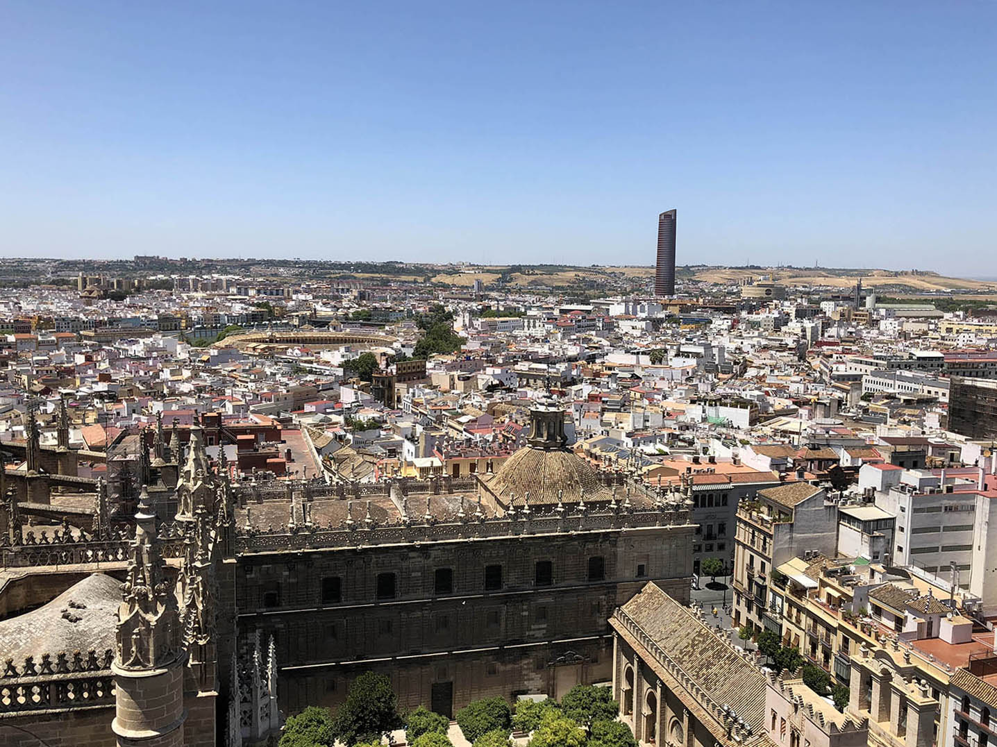 View towards northwest from La Giralda tower of Tabernacle church dome and general view of Seville.