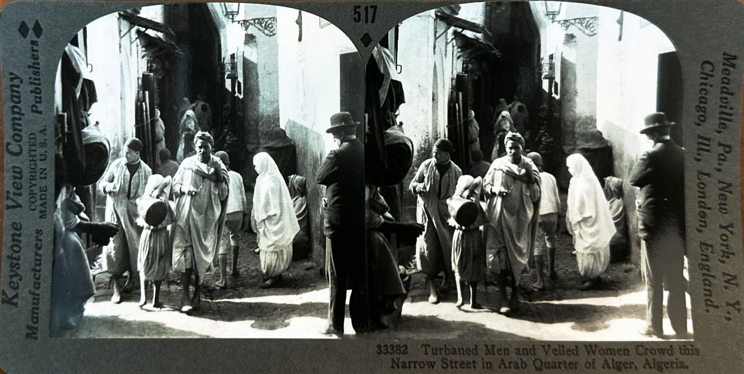 <p>Turbaned men and veiled women crowd this narrow street in Arab quarter of Alger, Algeria. (sic) </p>