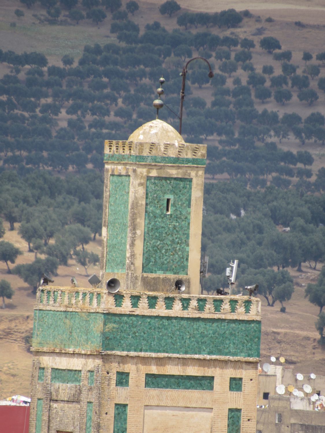 Exterior view, minaret apex and adhan megaphones.
