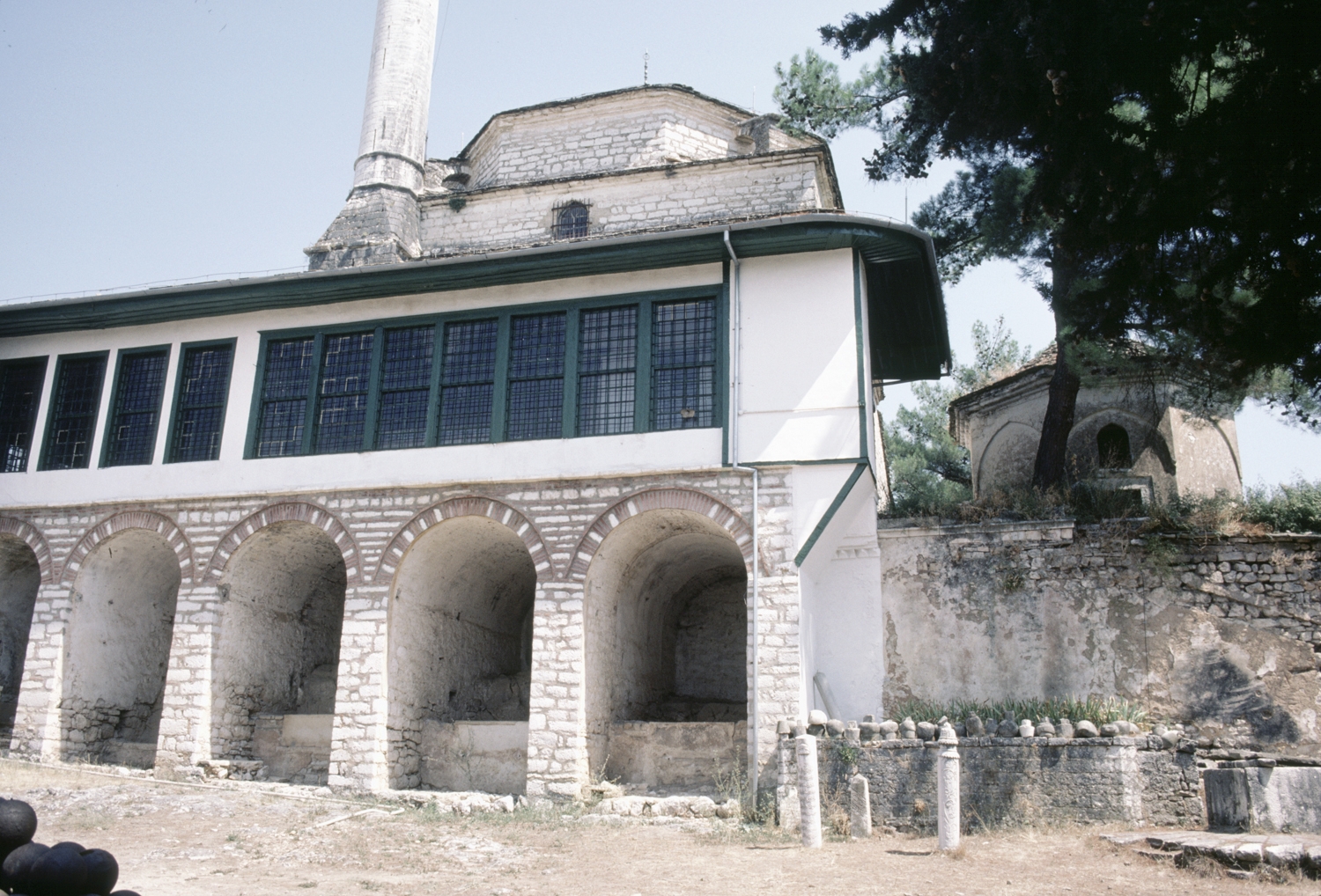 Southern elevation, showing closed portico over stone vaults for ablution; eight-sided mausoleum believed to belong to Aslan Pasha at right