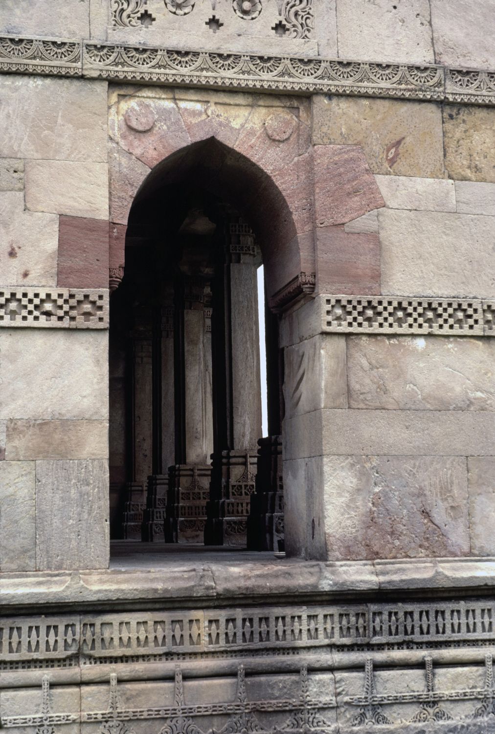Exterior view of south wall showing arched doorway.