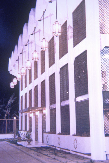 Exterior detail showing mashrabiyya screens and lighting