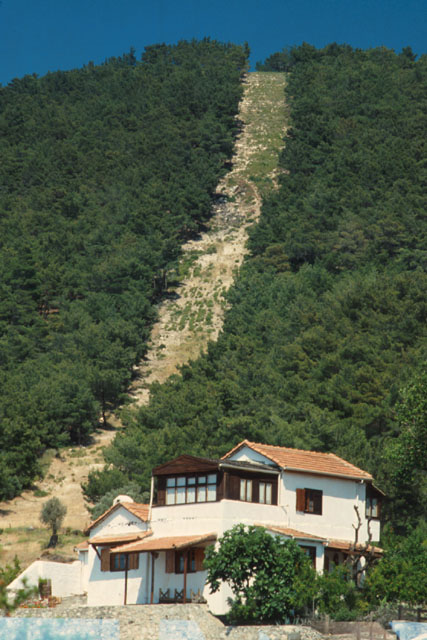 Exterior view showing path through mountain side forest