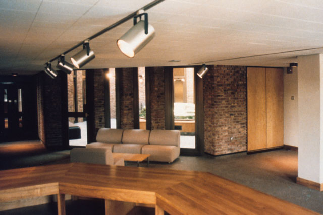 Interior view showing contrasting textures of brick and wood