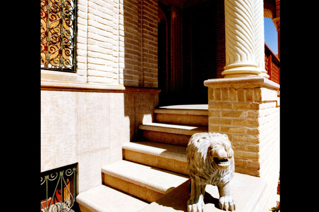 Exterior detail showing carved column and lion statue
