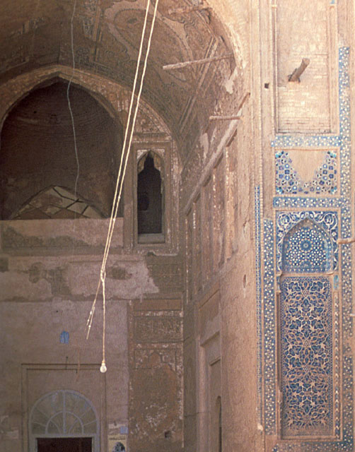 Madrasa-i Shamsiya - Courtyard detail of south iwan; remnants of tile decoration on right flank of iwan arch