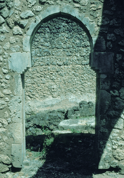 Arched doorway leading from the south to the north hall.