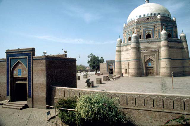 Exterior view from east, with precinct wall and the eastern gate