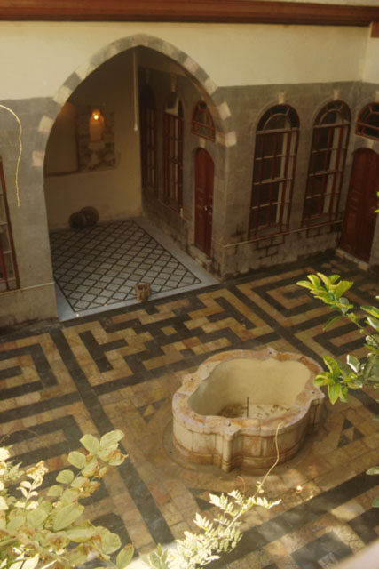 Elevated view to courtyard showing fountain and ablaq paving