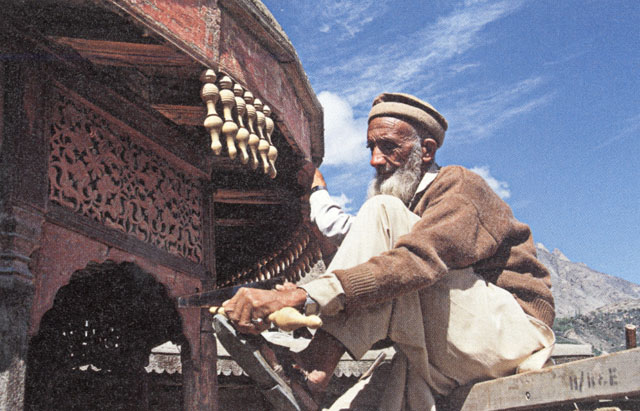 Baltit Fort Restoration - Old master carpenter repairing the timber decoration of the royal dais