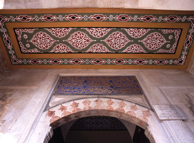Foundation inscription and painted ceiling of north courtyard portal
