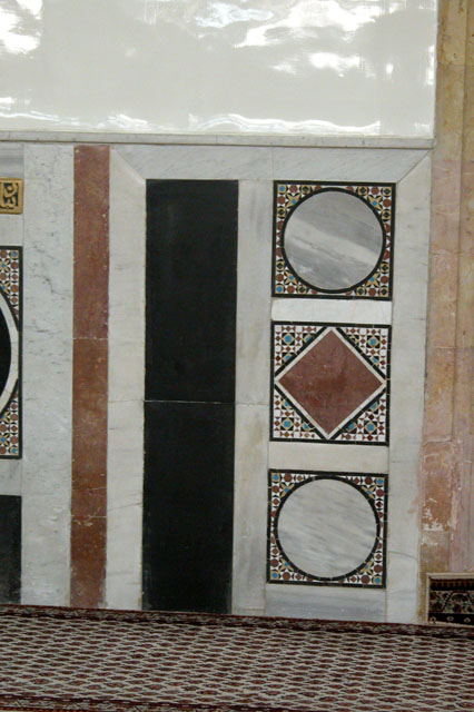 View of the interior walls of the prayer hall with stone decorative patterns