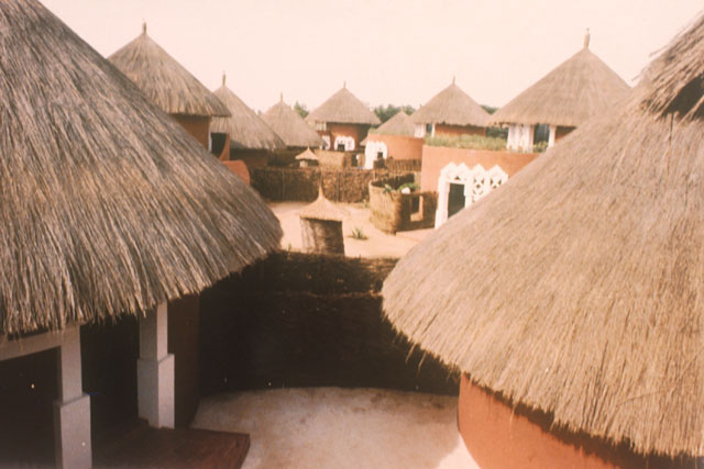 Elevated view showing paths through thatch roof huts