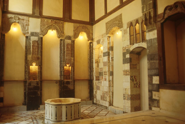 Interior view showing inlaid marble and wood built in furniture of double story qa'a