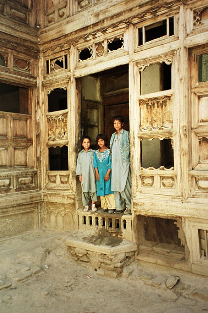 Amin House Restoration - Northeast corner of courtyard with children in doorway