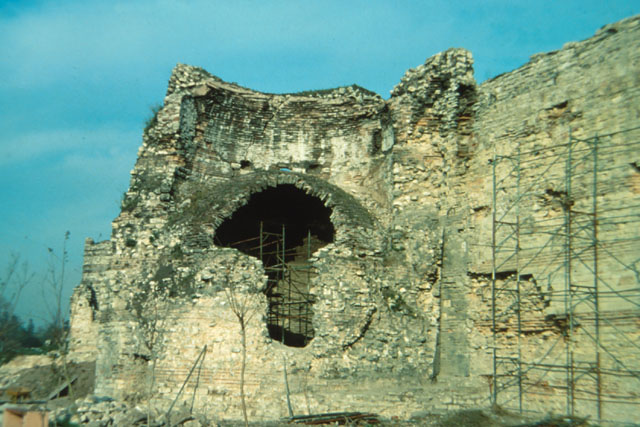 Exterior view showing dilapidated fortress walls