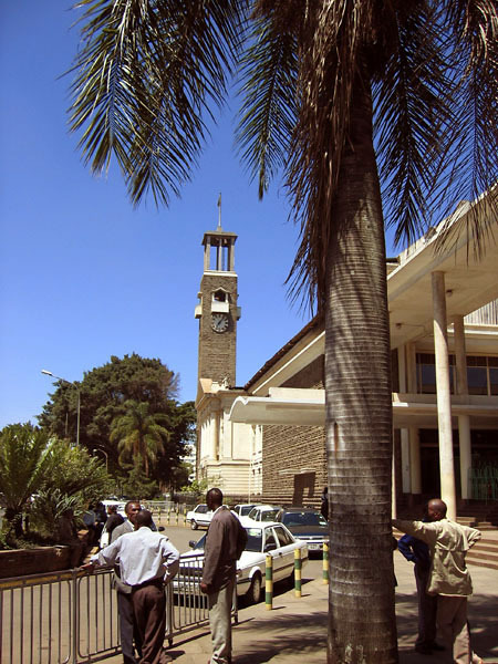 Nairobi City Hall - Exterior view, showing curved driveway leading to the main entrance, with clock tower seen in background
